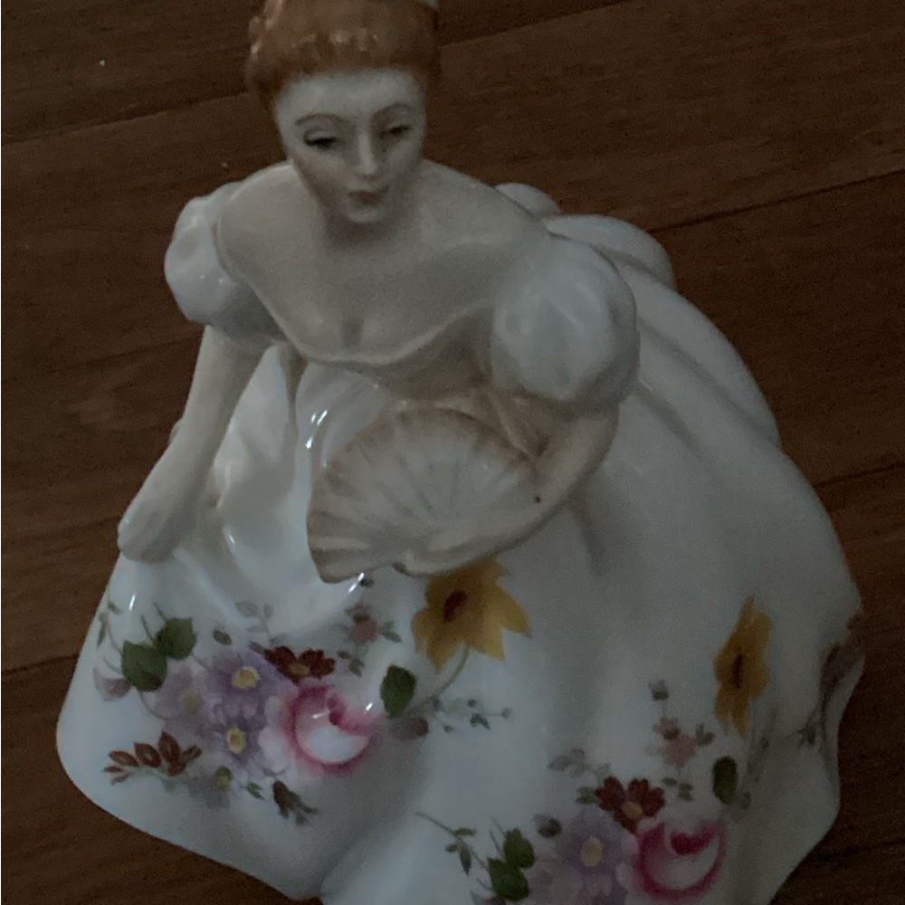 Elegant Porcelain Figurine with Floral Dress